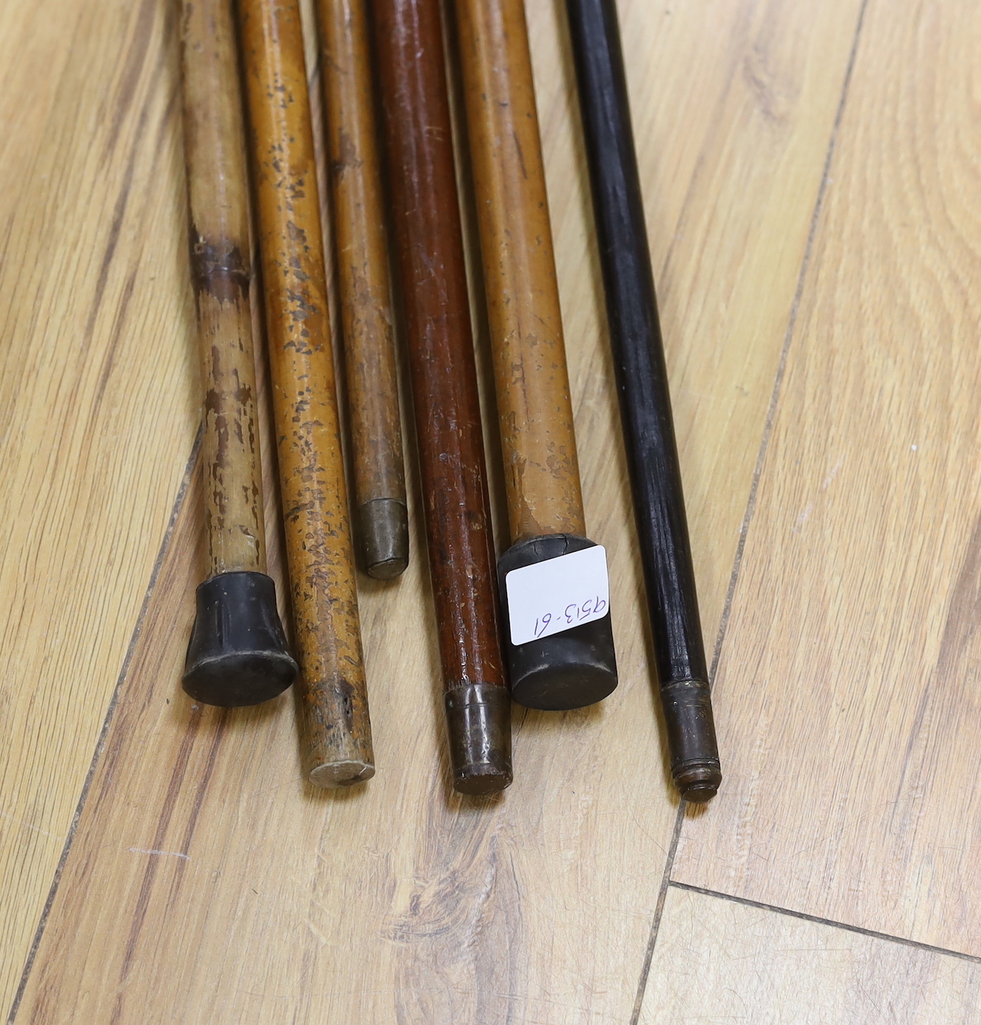 A group of six various silver mounted walking sticks/canes, one with horn handle